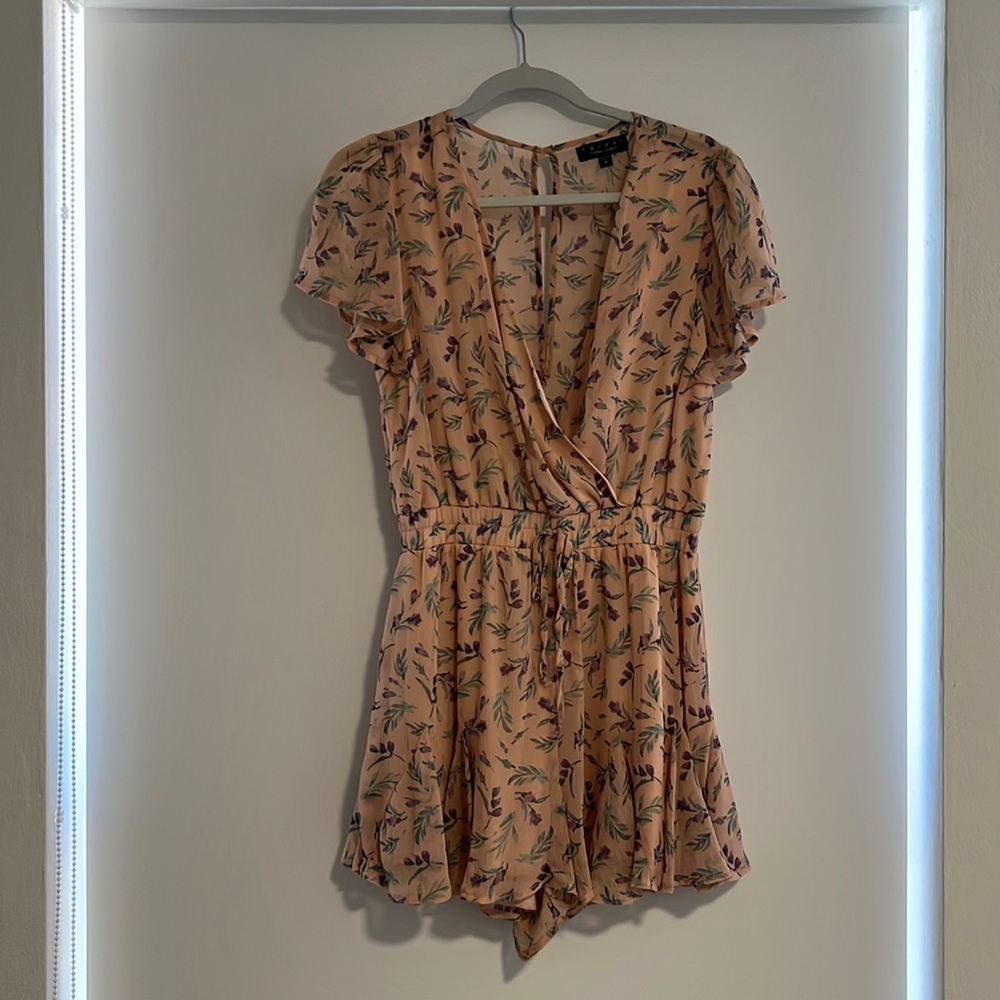 Floral Romper. Worn twice in great condition, like new. Size is Medium.